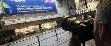 A photographer from Spain takes a photo of the welcome sign outside Amsterdam's RAI Center